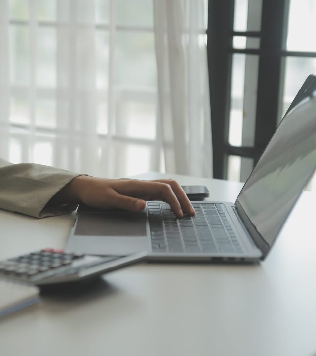 Businesswoman or accountant working Financial investment on calculator, calculate, analyze business and marketing growth on financial document data graph, Accounting, Economic, commercial concept.